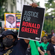 In this Thursday, May 27, 2021, file photo, demonstrators stand in front of the governor’s mansion after a march from the state Capitol in Baton Rouge, La., protesting the death of Ronald Greene, who died in the custody of Louisiana State Police in 2019. A reexamined autopsy ordered up by the FBI in the deadly arrest of Greene has rejected the Louisiana State Police claim that a car crash caused his fatal injuries, narrowing prosecutors’ focus on the troopers seen on body camera video beating, stunning and dragging him.